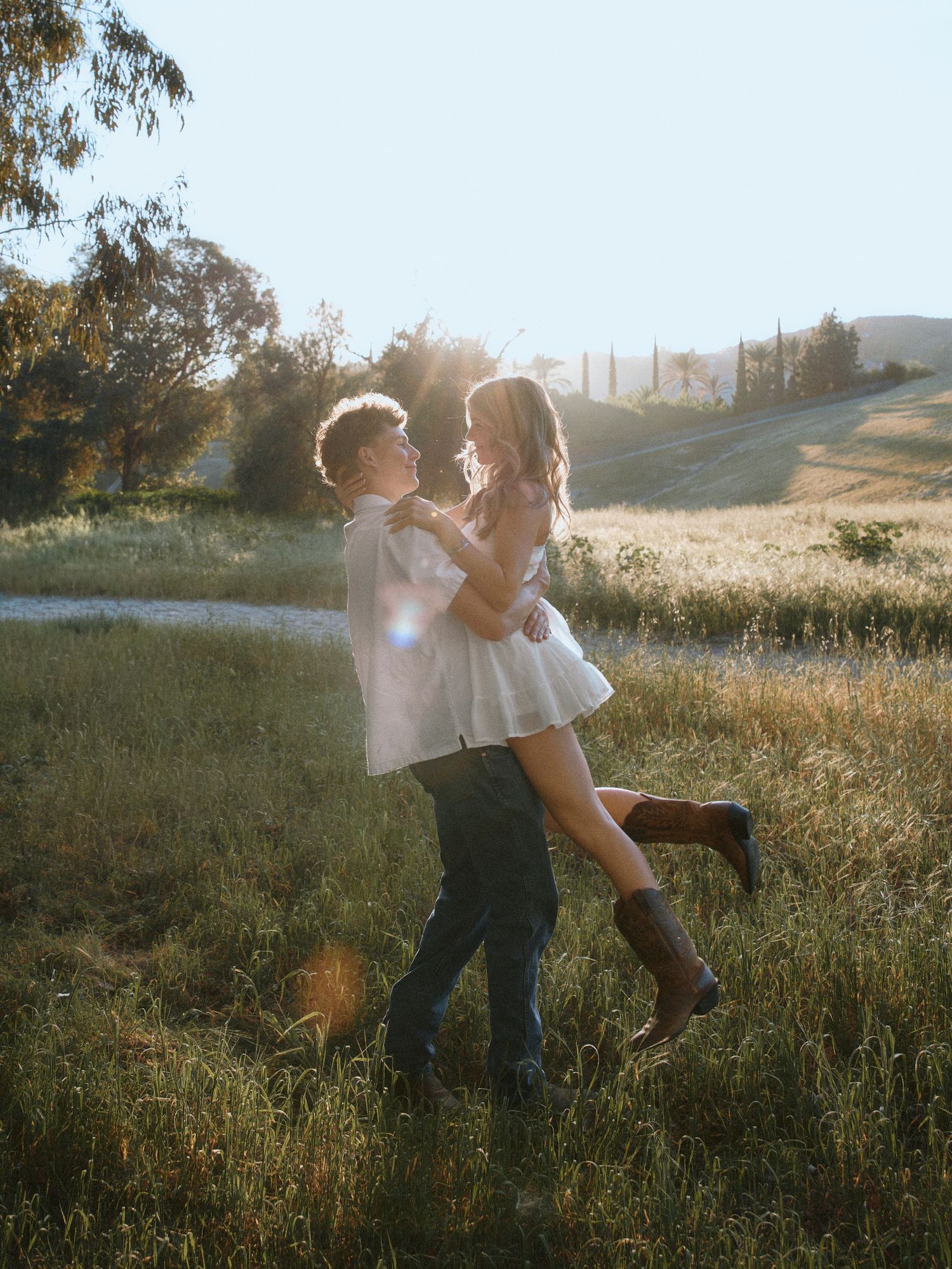 Dreamy sunset couple’s portrait with a horse, perfect for western-style wedding announcements in Los Angeles.