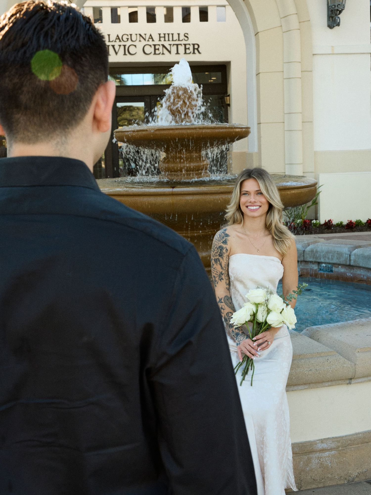 Orange County elopement photographer capturing a couple by the fountain at Laguna Hills Civic Center.