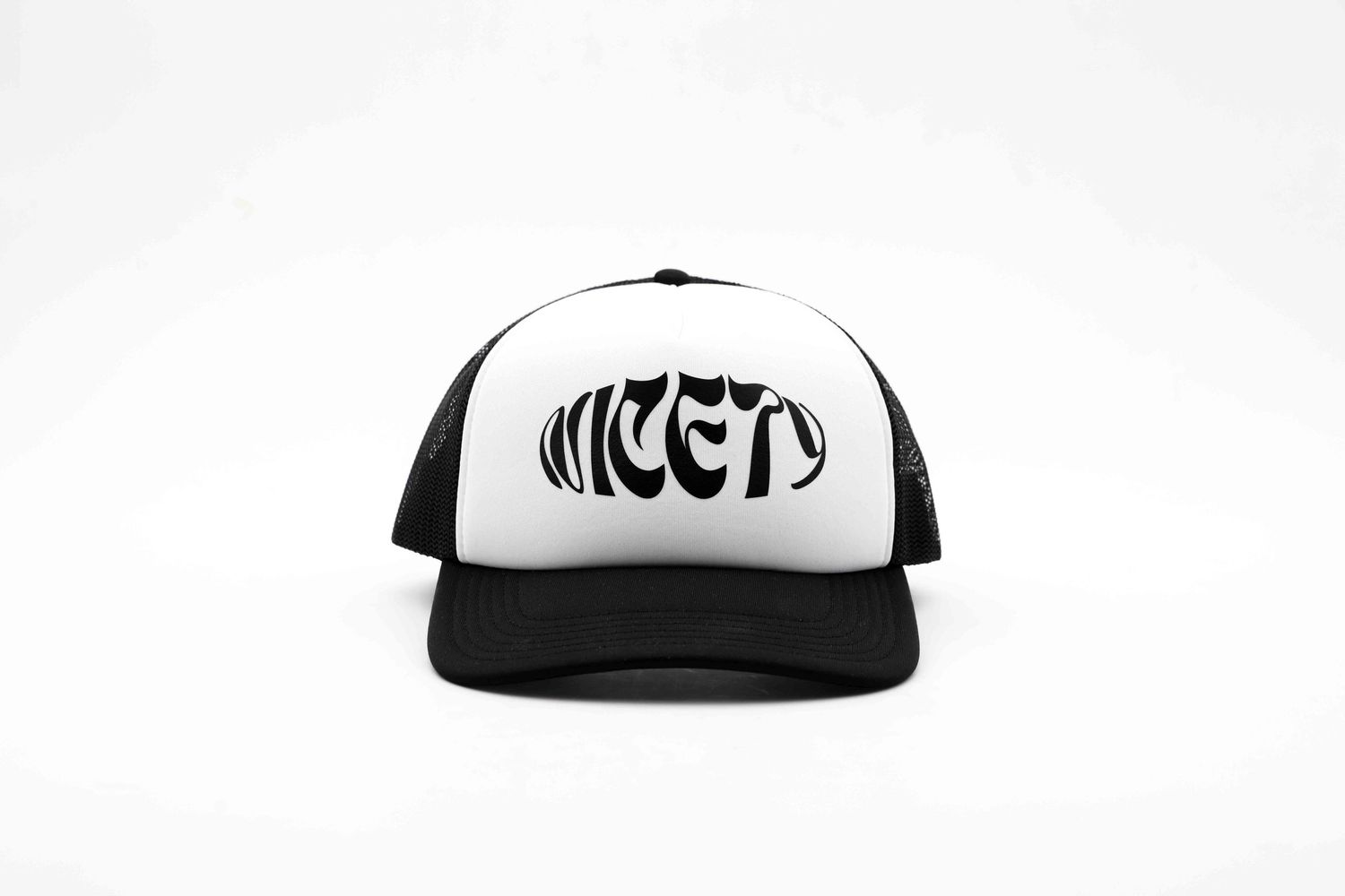 Collection of black and white trucker hats displayed in a row on white background.