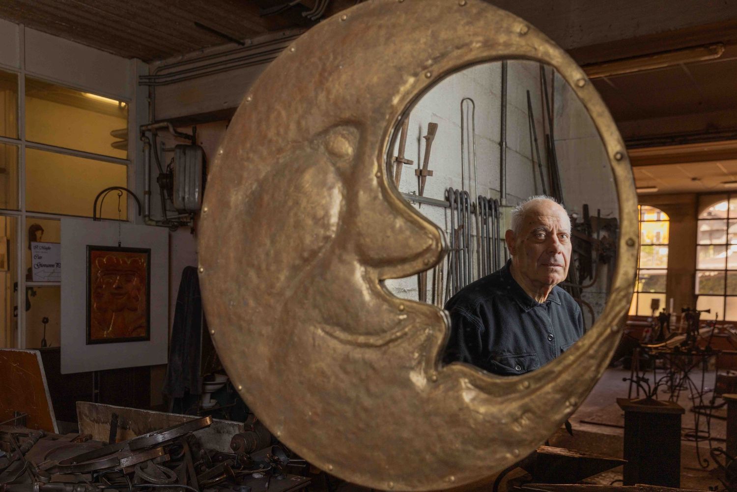 Large sculptural art installation in dimly lit indoor space.