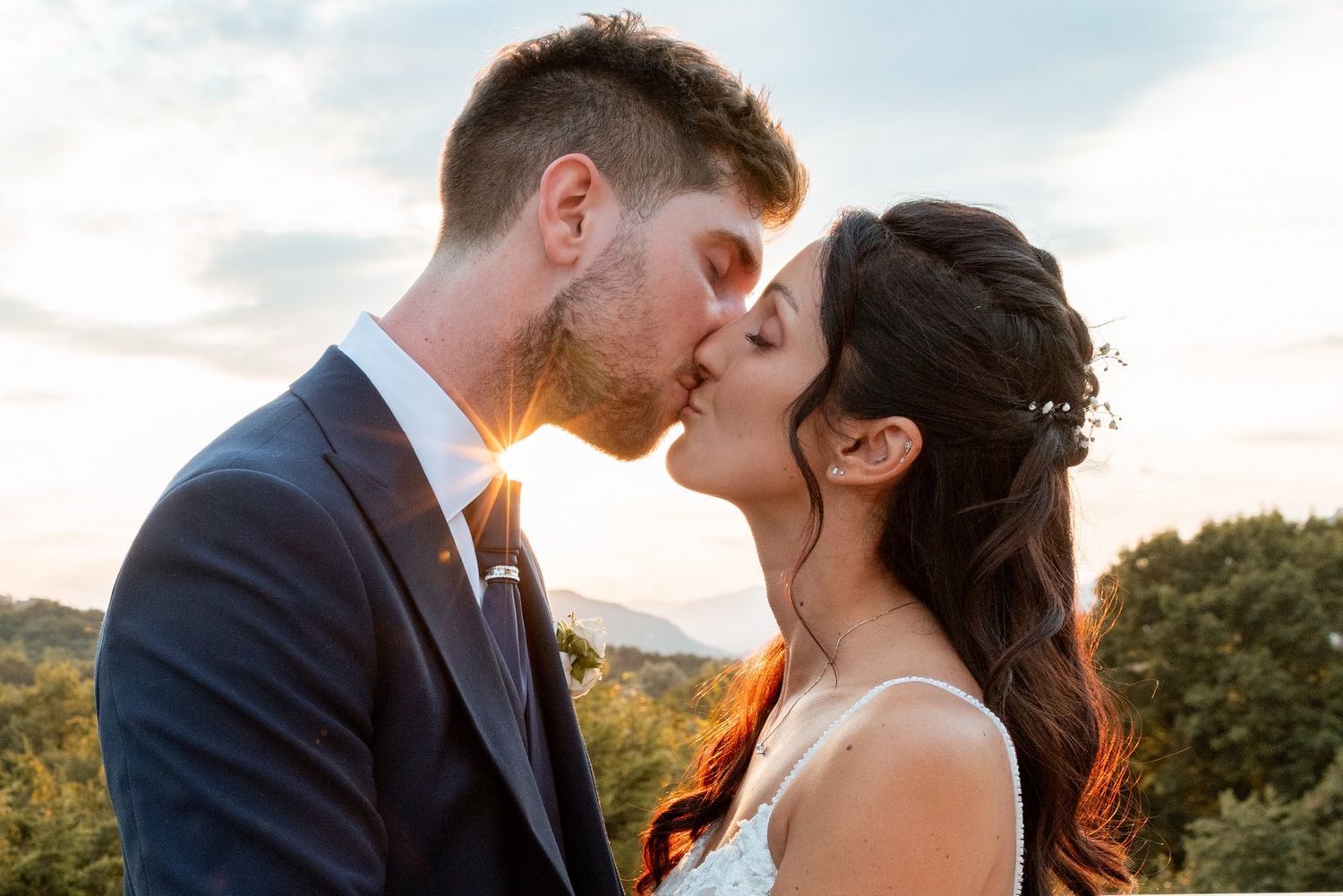 A romantic sunset wedding portrait session with mountain views in the background.