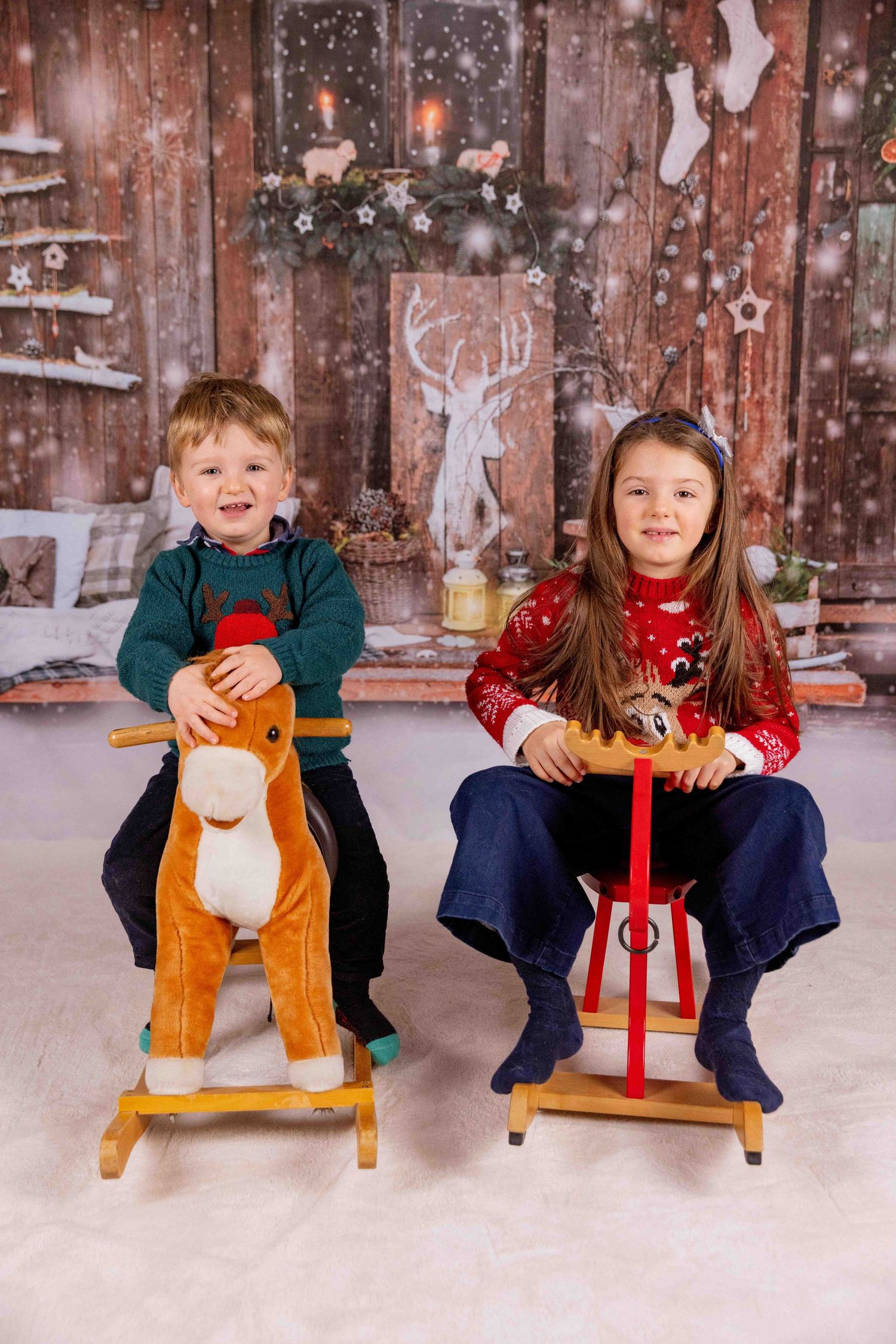 Playful winter scene with rocking horses and snowy decorations.