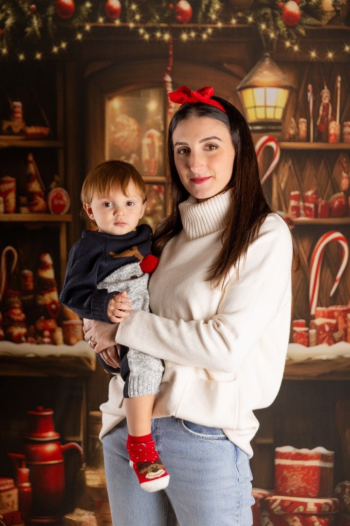 Cozy holiday scene with decorative lights and red ornaments creating warm Christmas atmosphere.