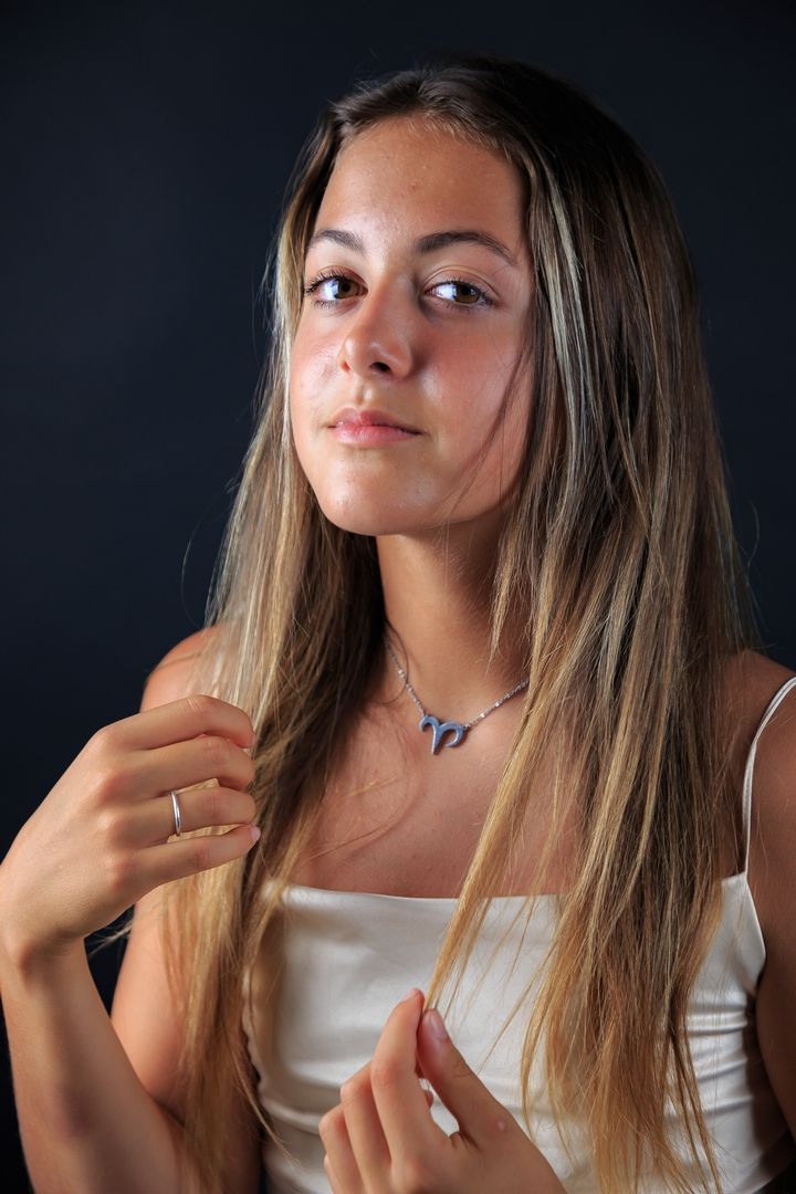 Artistic portrait sequence with dramatic lighting and contemplative poses.