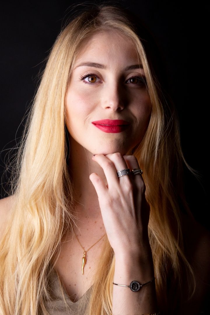Close-up beauty portraits with dramatic lighting highlighting blonde hair and red lipstick.