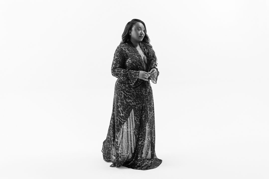 A series of five black and white photographs showing a person in a dress kneeling on the ground.