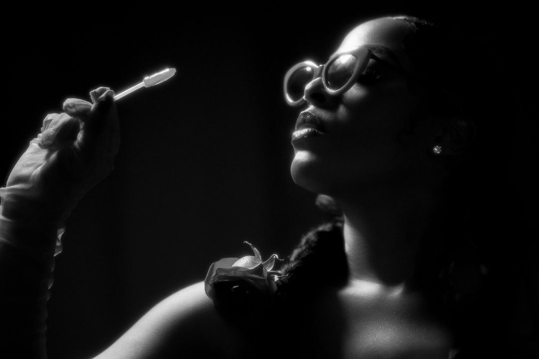 High contrast black and white profile portraits showing dramatic expressions and lighting.