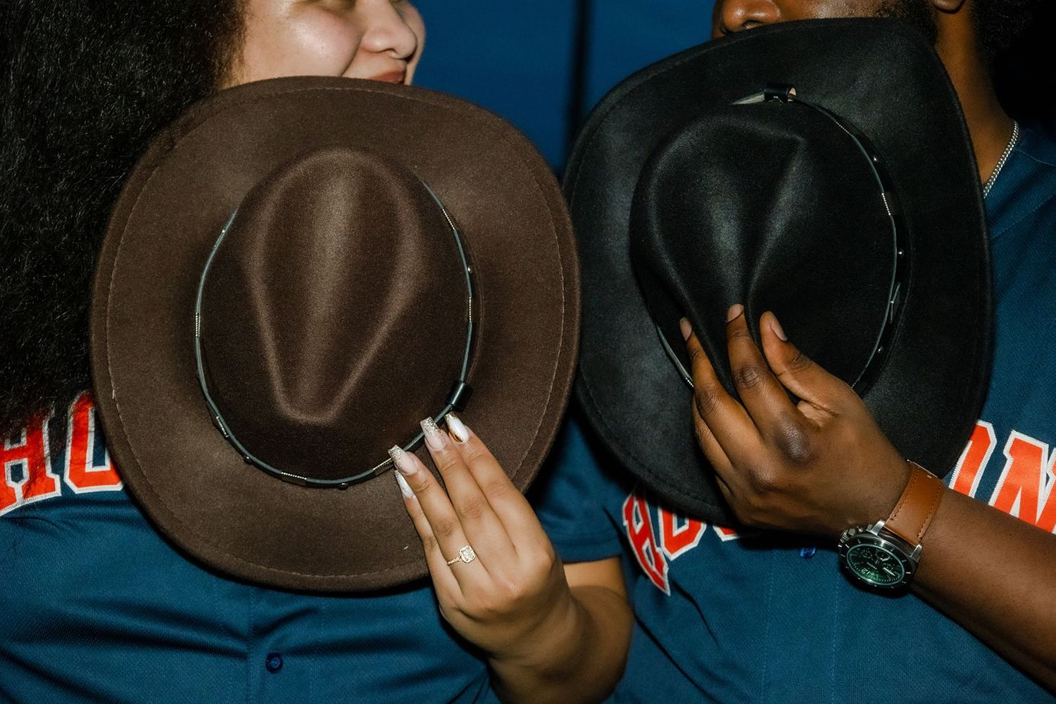 A sequence of photos showing someone tipping their brown fedora hat in a playful manner against a dark background.