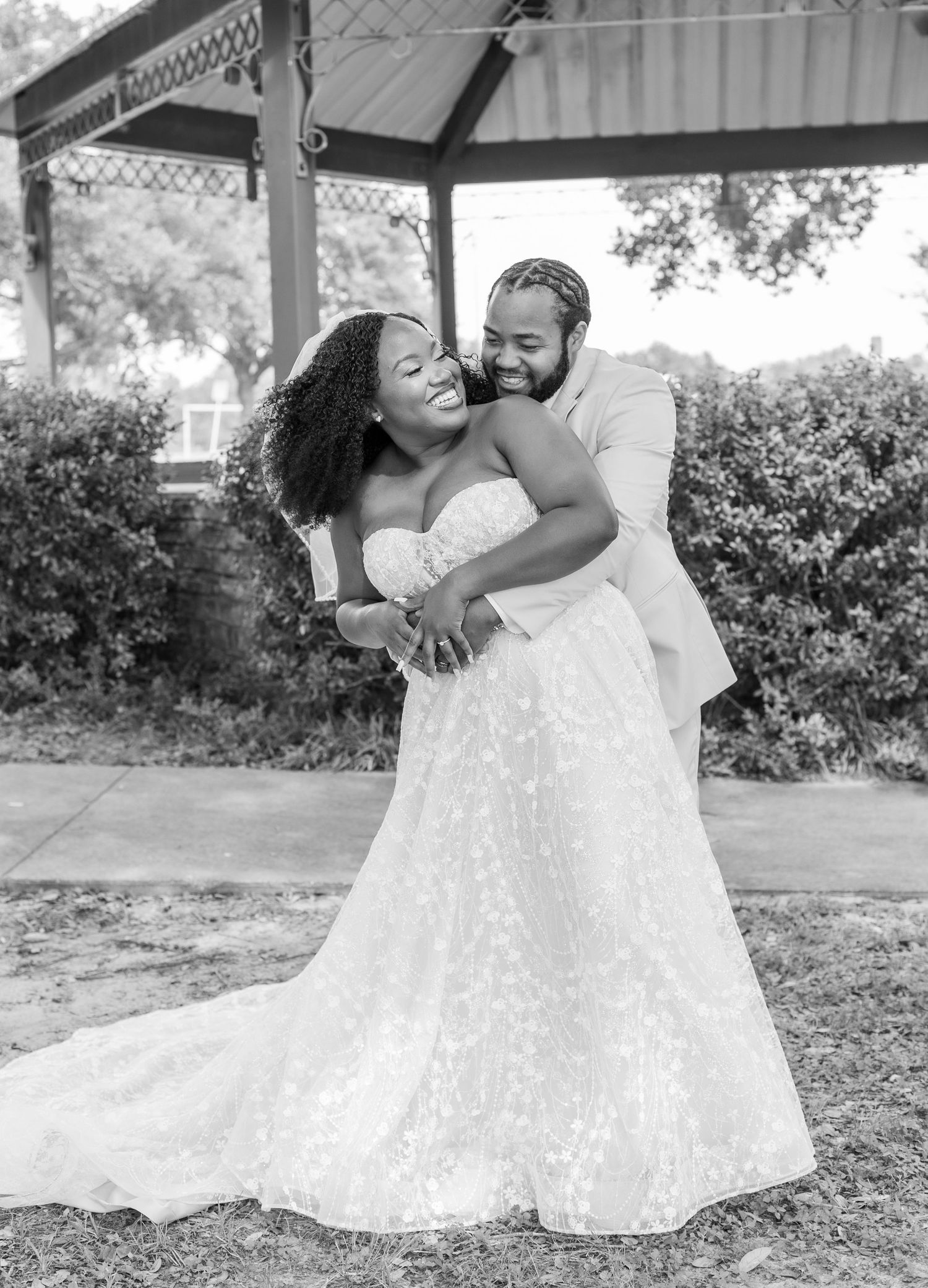 Black and white wedding photography sequence capturing intimate moments between a couple in an outdoor setting.
