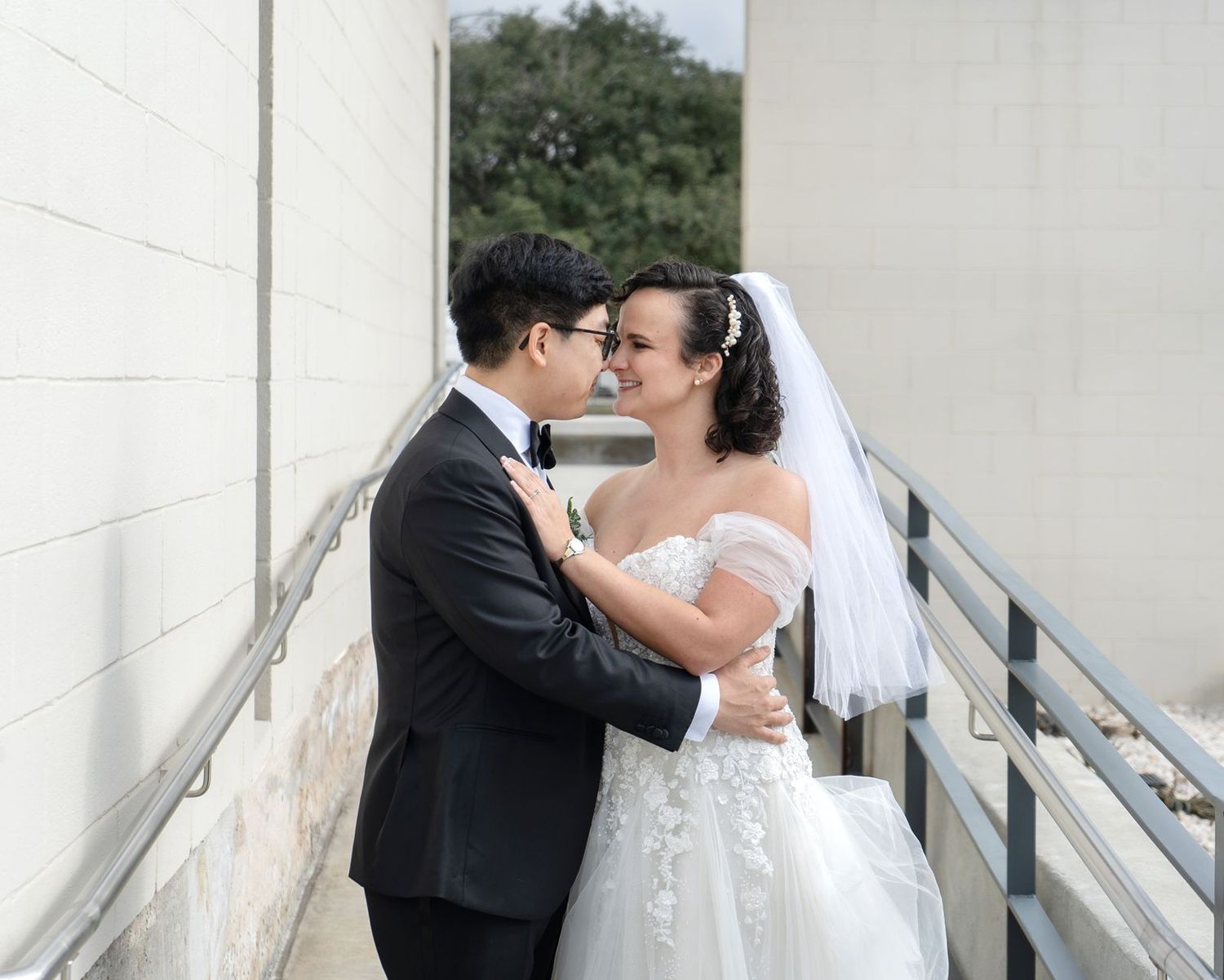 Wedding couple shares intimate moments in black and white photos against a white backdrop.
