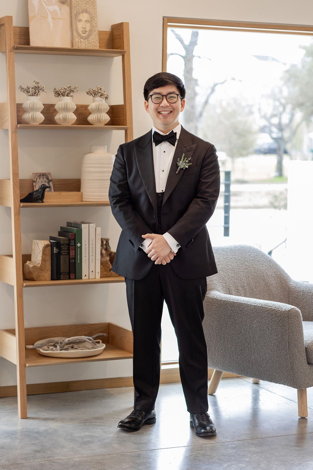 A series of cropped photos showing details of a formal black suit, dress shoes, and wooden shelving in an interior space.