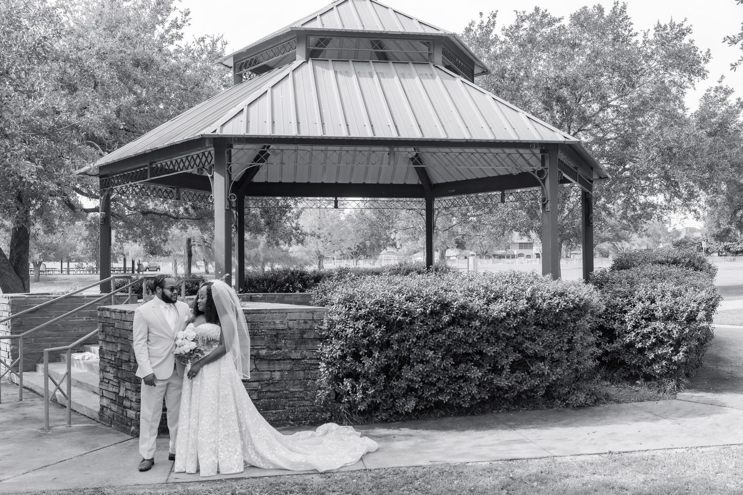 Sequence of romantic photos under a pavilion showing the train of a white wedding dress flowing in the breeze.