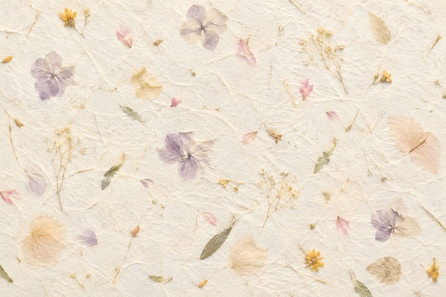 Handmade paper texture with pressed wildflowers in soft pink, purple, and yellow hues on a cream background.