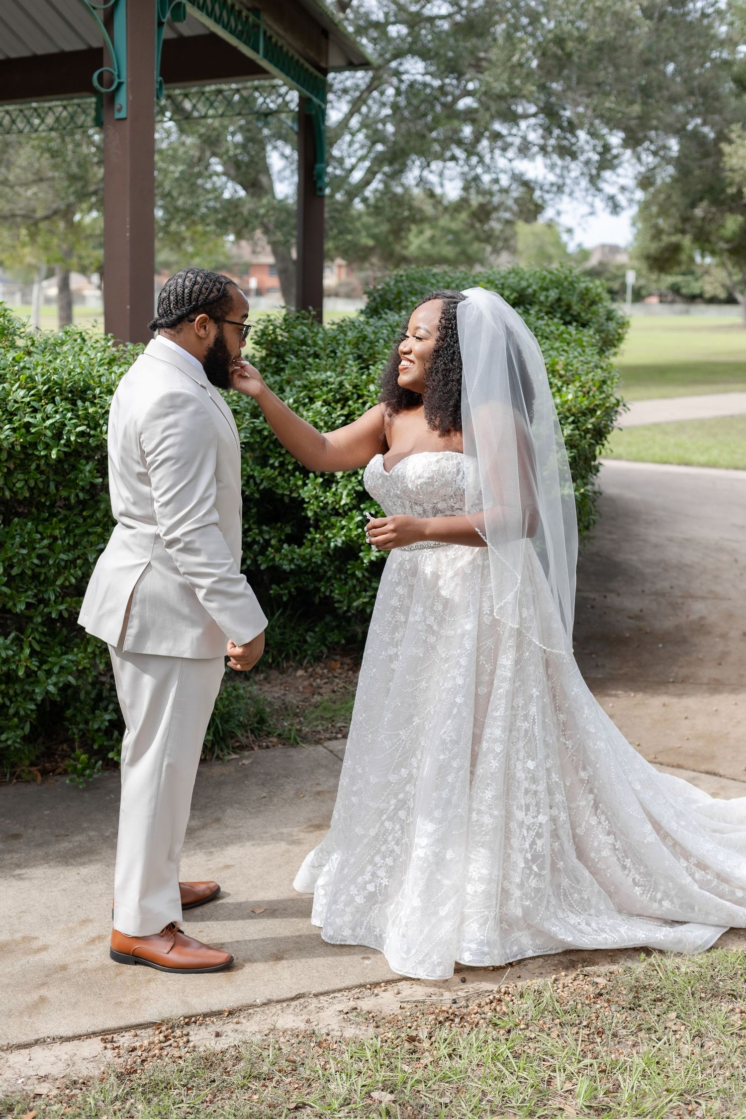 A romantic wedding photoshoot series showing tender moments under a covered outdoor area with lush greenery.