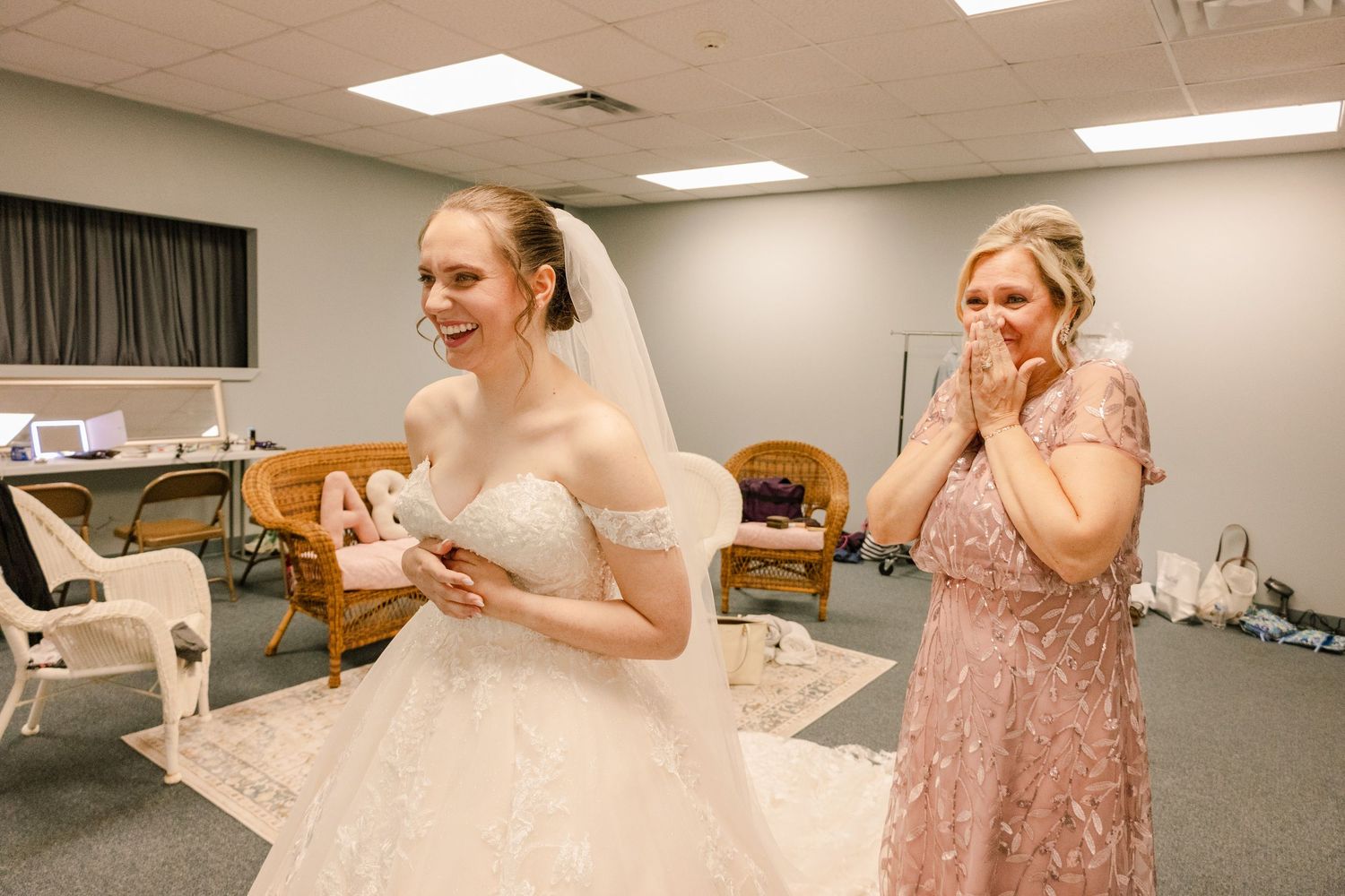 Candid moments during bridal party preparation in salon dressing room.