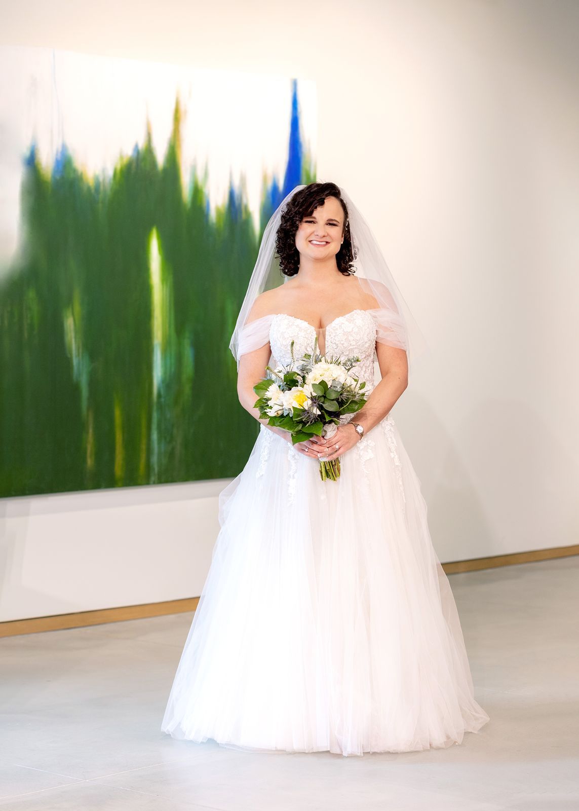 A bride in a flowing white ballgown wedding dress poses for a series of photos showing the dress from different angles.