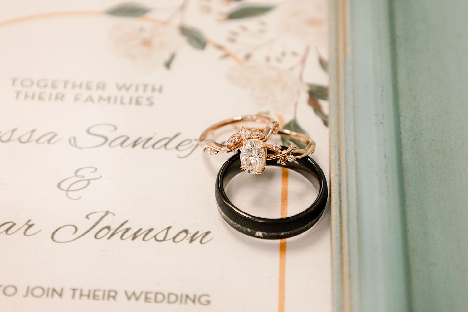 Close-up of elegant wedding invitation text and details in vintage frames.