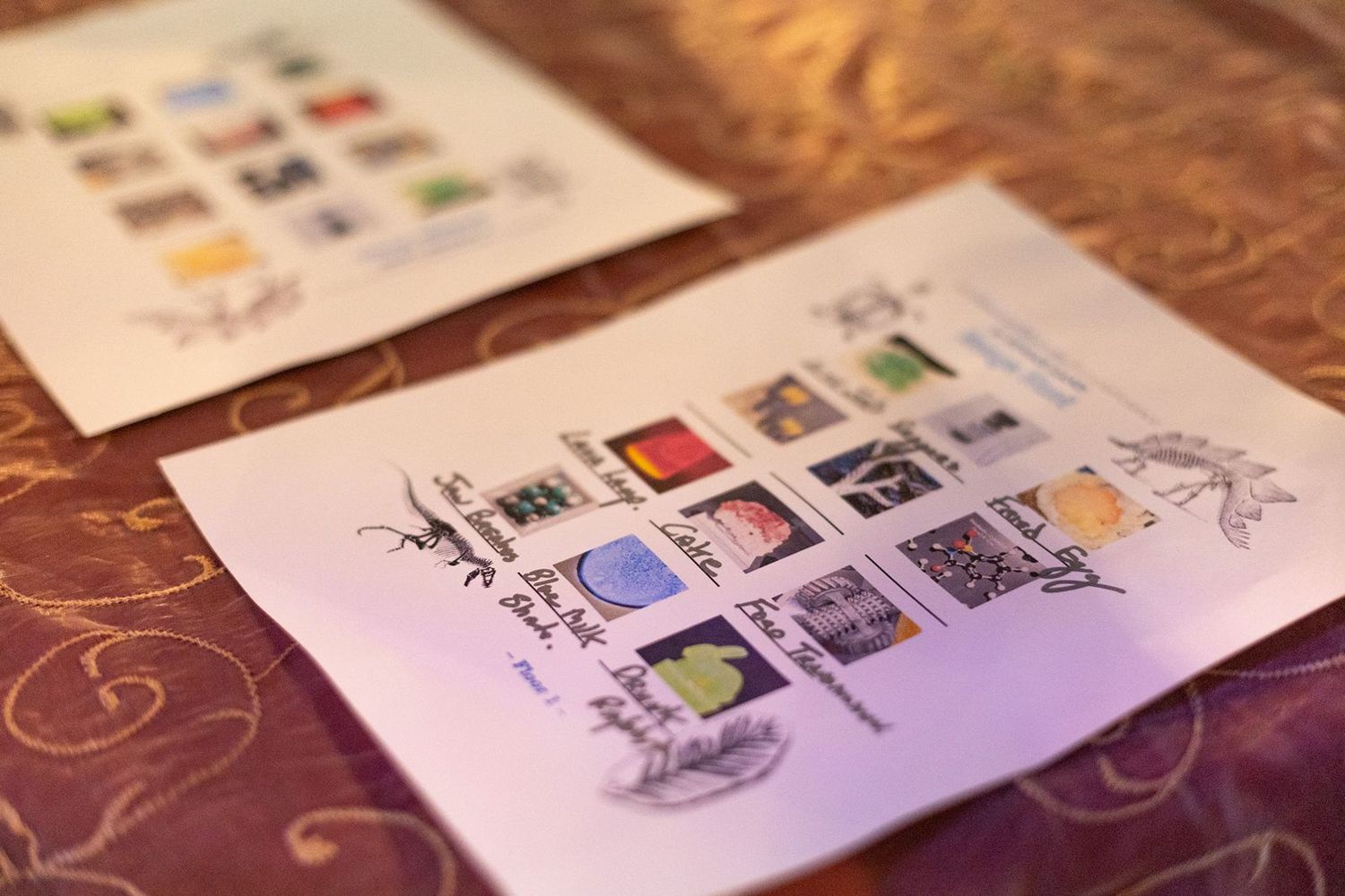 Sheets of colorful postage stamps displayed on a decorative table surface.