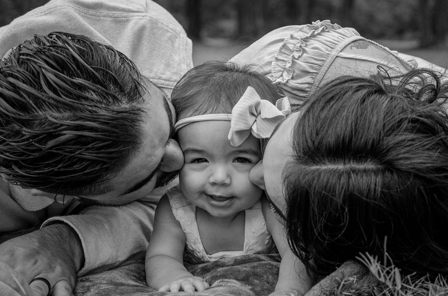 Black and white collage of candid moments showing laughter and joy between people in close-up shots.