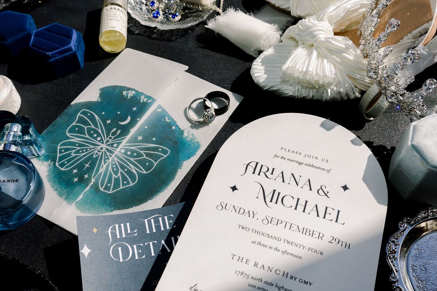 Wedding invitation suite featuring elegant teal and silver designs with floral motifs and metallic accents.