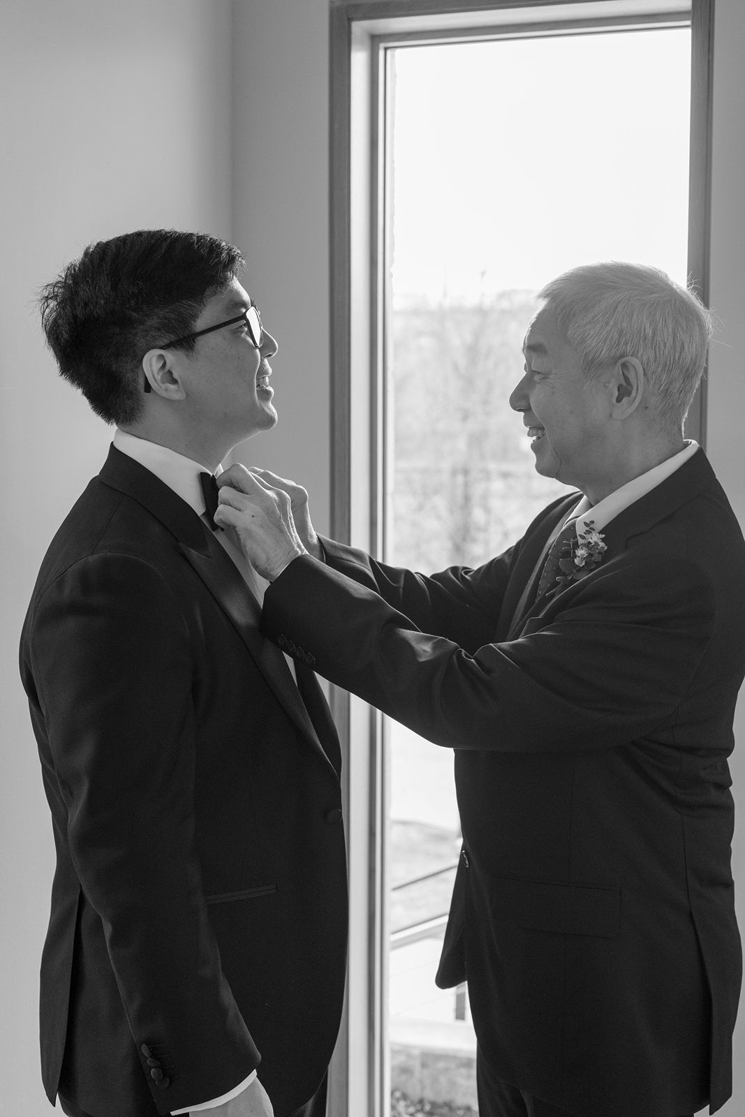 Two men in business suits engaged in a physical altercation shown in multiple sequential frames by a window.