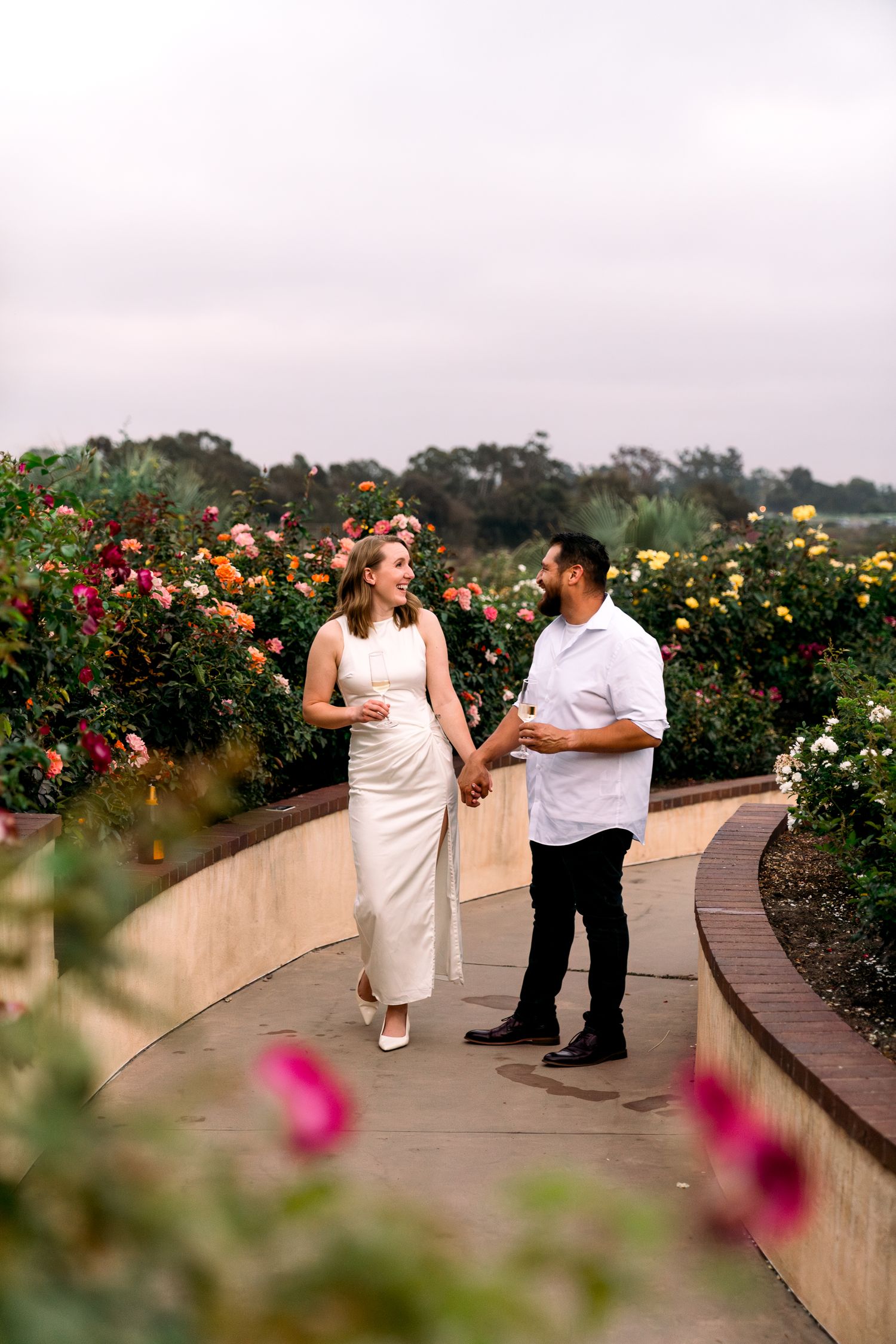 San Diego Bride and Groom Engaged At Balboa Park Kissing Luxury Southern California WEdding Photographer