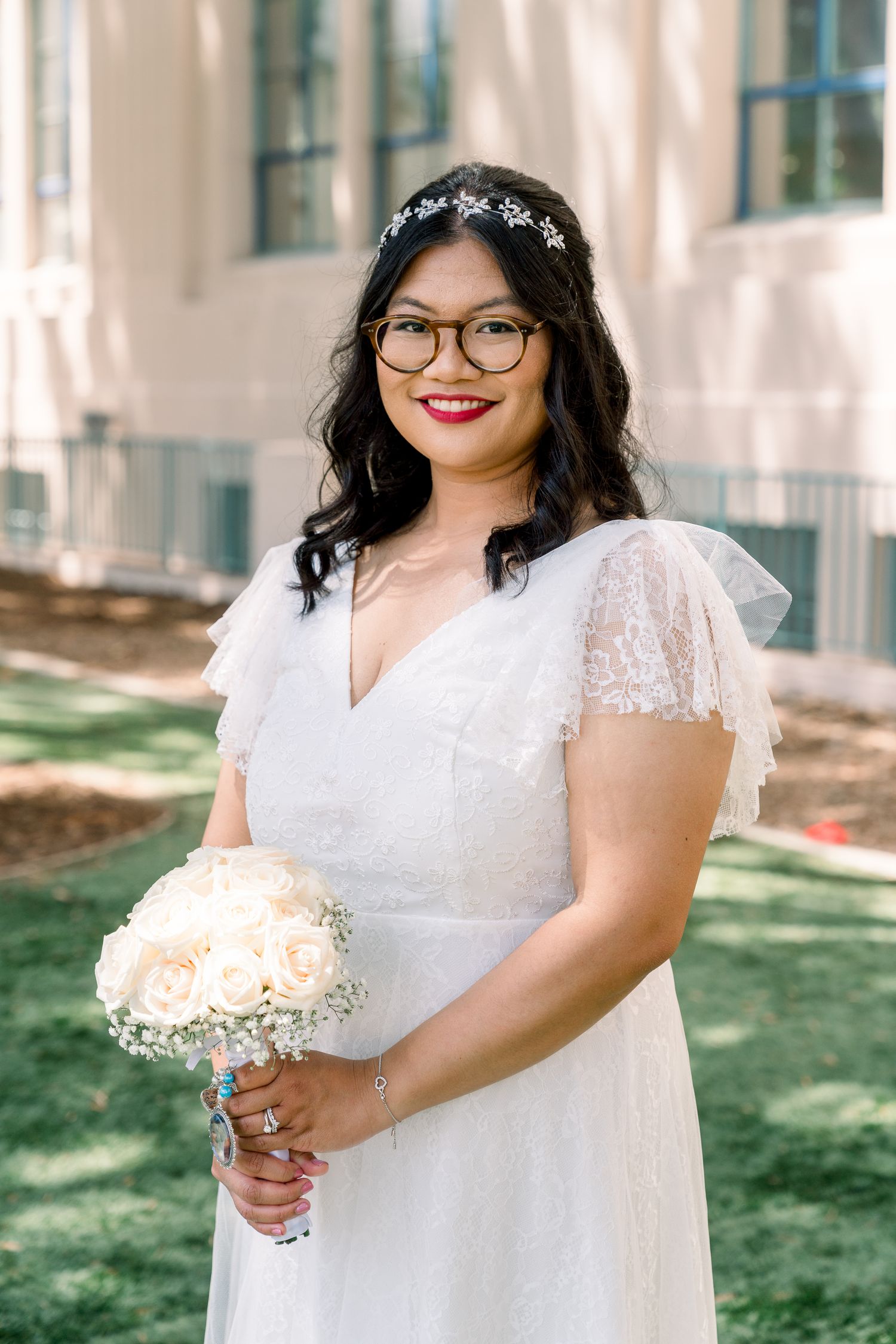 A beautiful bridal portrait outdoors with a classic white bouquet.