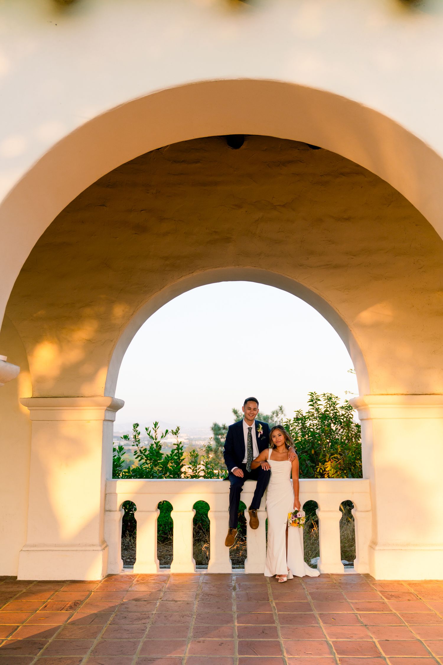 Couple Kissing or Engagement Photos at Junipero SErra Museum with Spanish architecture
