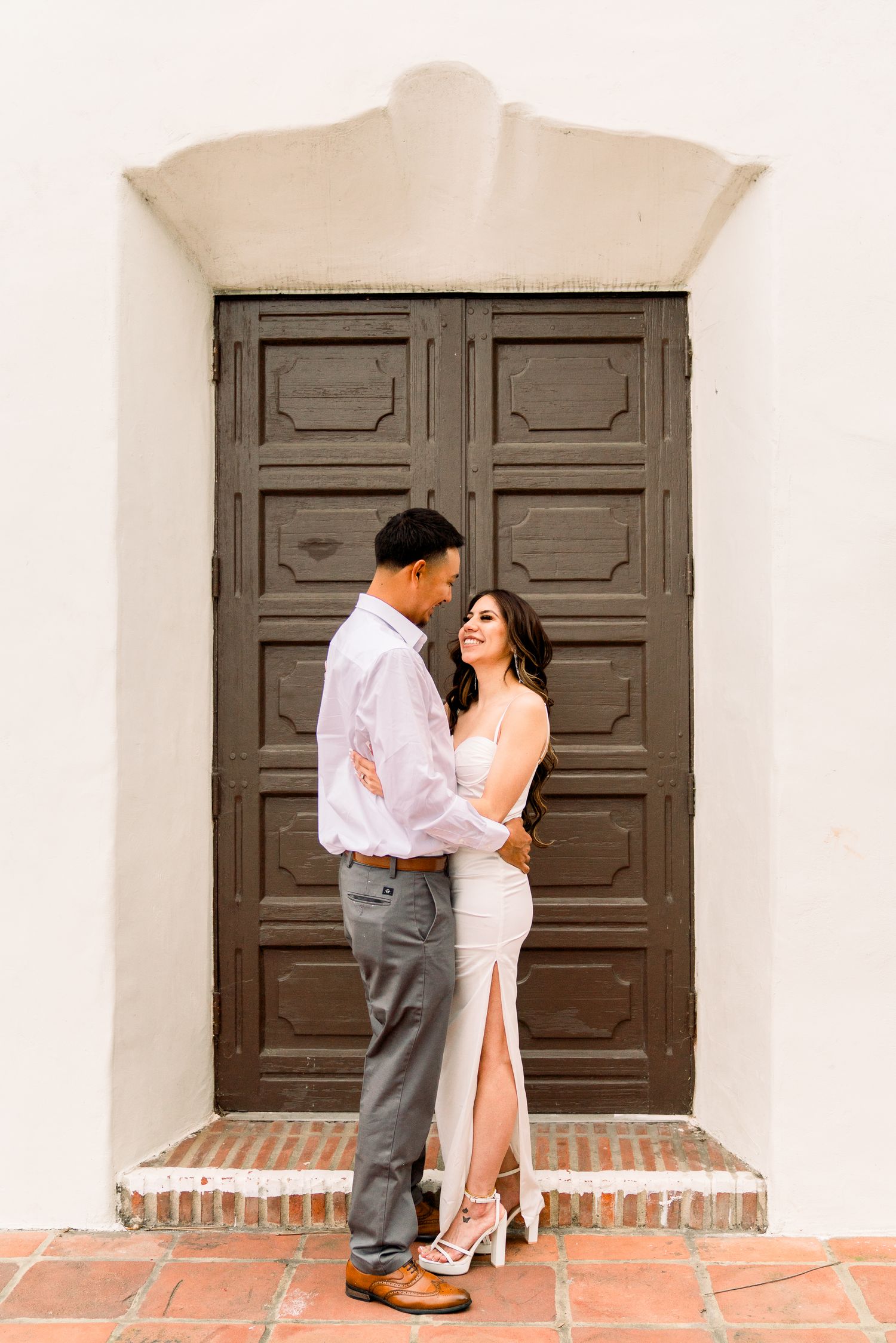 Engagement portraits at The Junipero Serra Museum with a San Diego wedding photographer Unique Engagement Photography