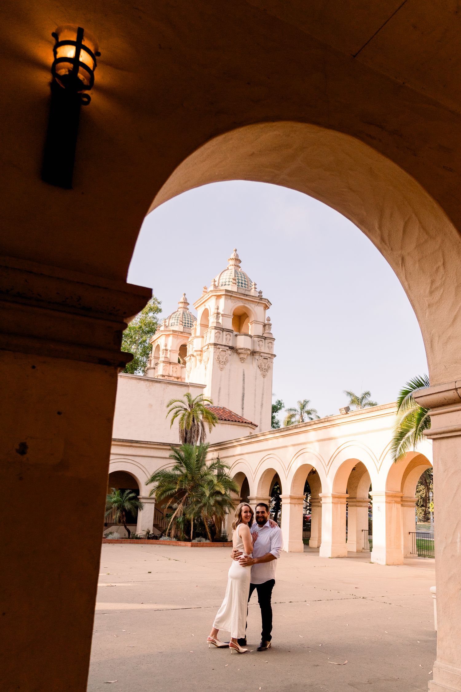 San Diego Bride and Groom Engaged At Balboa Park Kissing Luxury Southern California WEdding Photographer