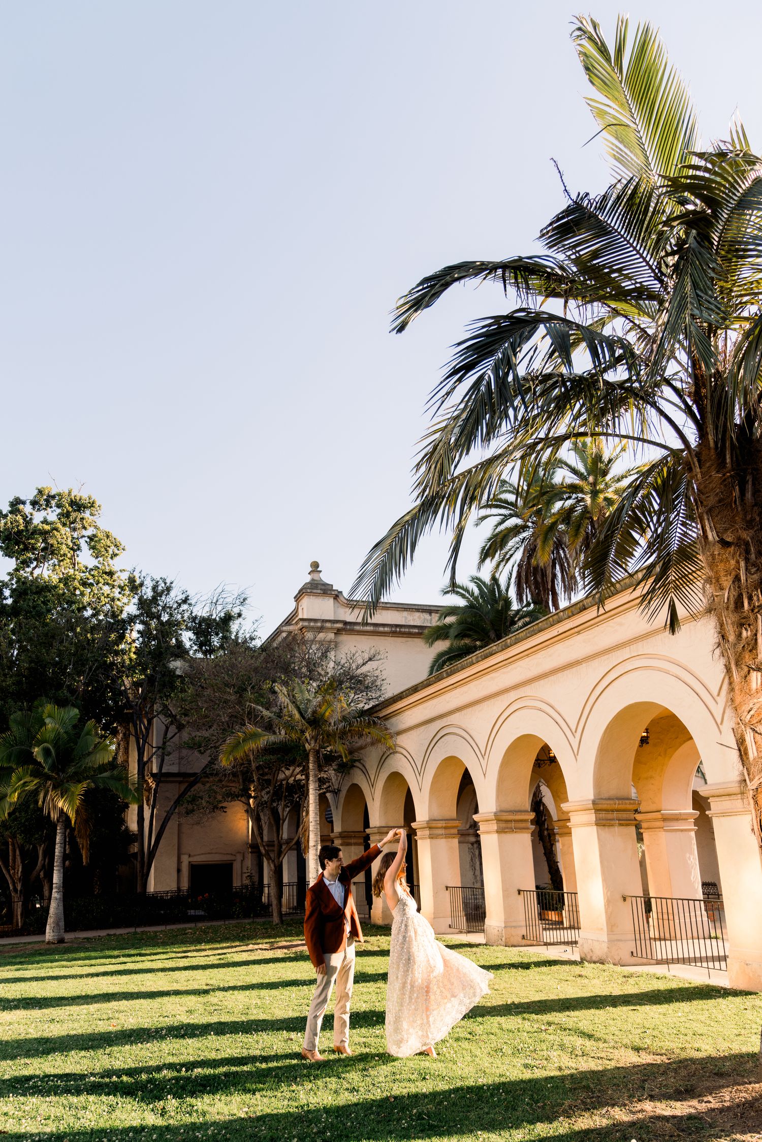 San Diego Bride and Groom Engaged At Balboa Park Kissing Luxury Southern California WEdding Photographer