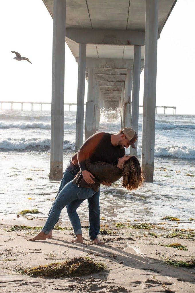 Engagement photos at the beach with a San Diego wedding photographer- at ocean beach