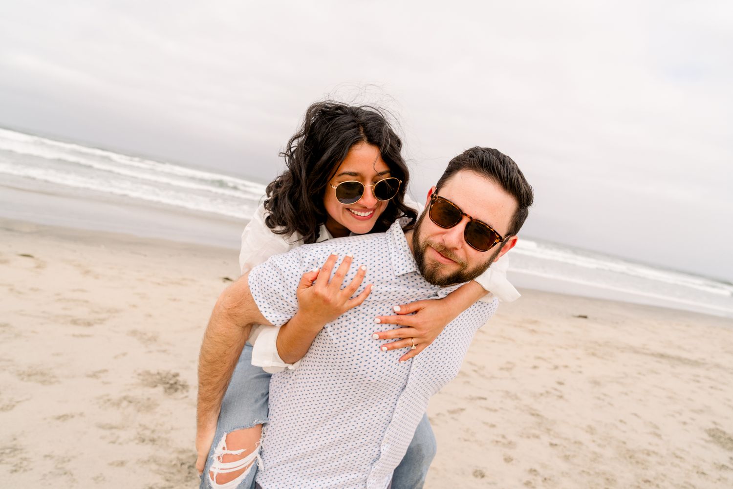 Romantic beach engagement session for San Diego couples at Del Mar Dig Beach with Pup
