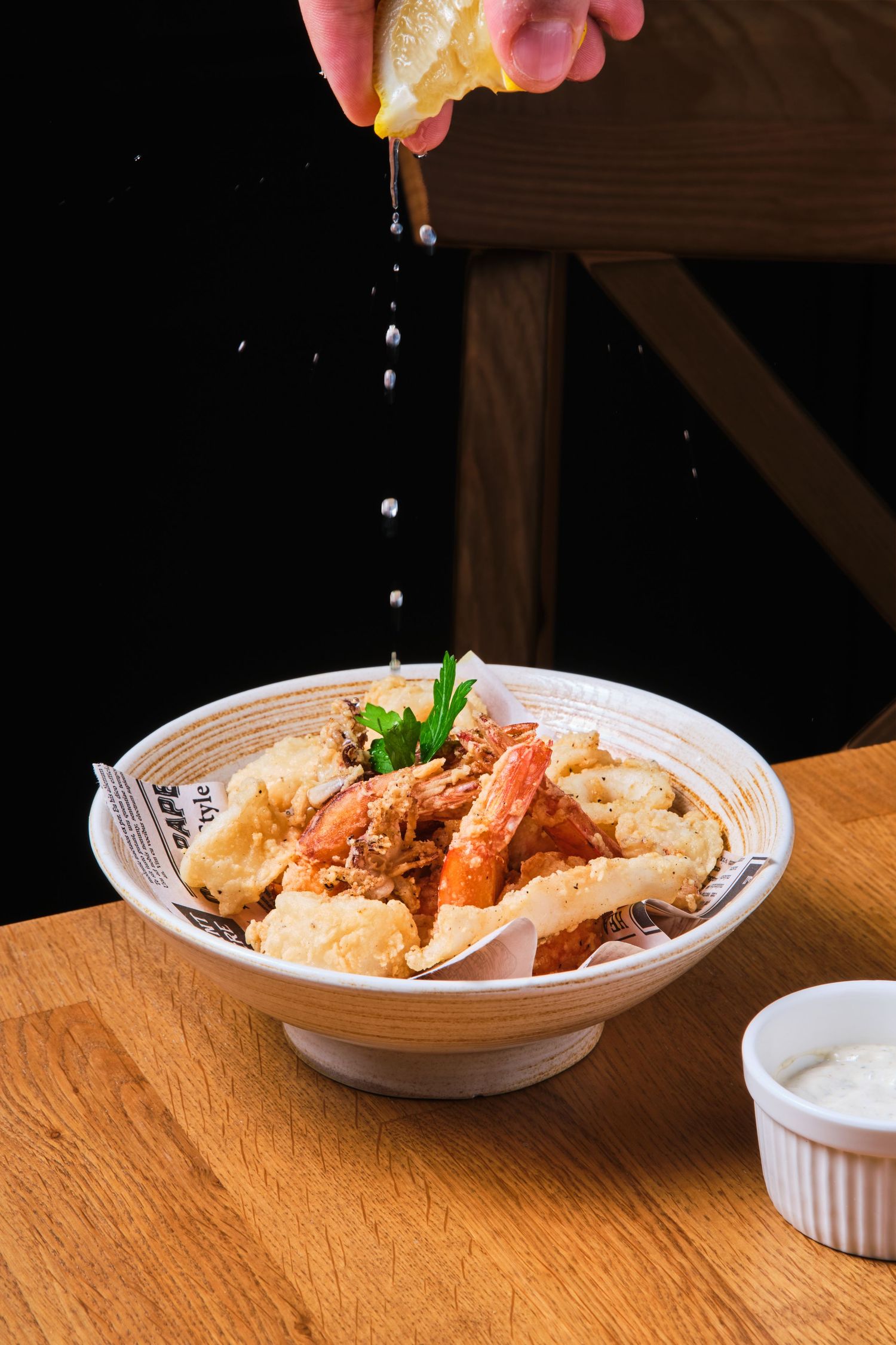 Fritto misto, fried mixed seafood with lemon