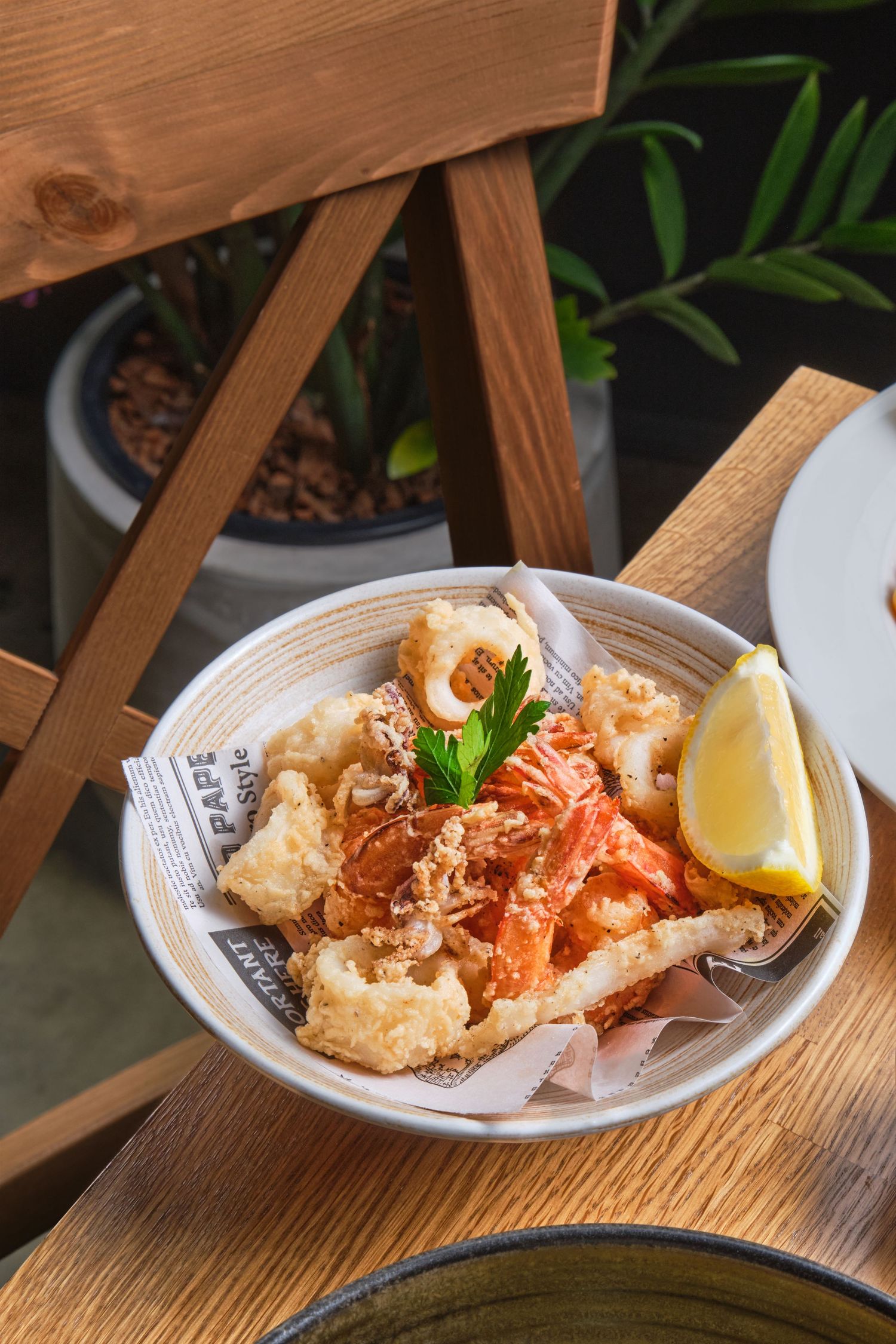 Fritto misto, fried mixed seafood with lemon