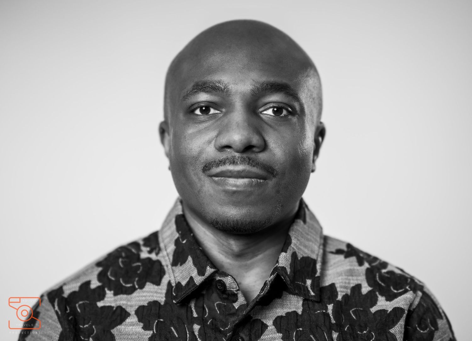 Black and white portrait series shot against a plain background.