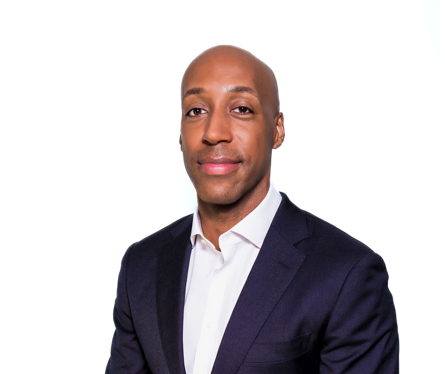 Professional headshot photos of three men wearing navy suits and white dress shirts against gray background.