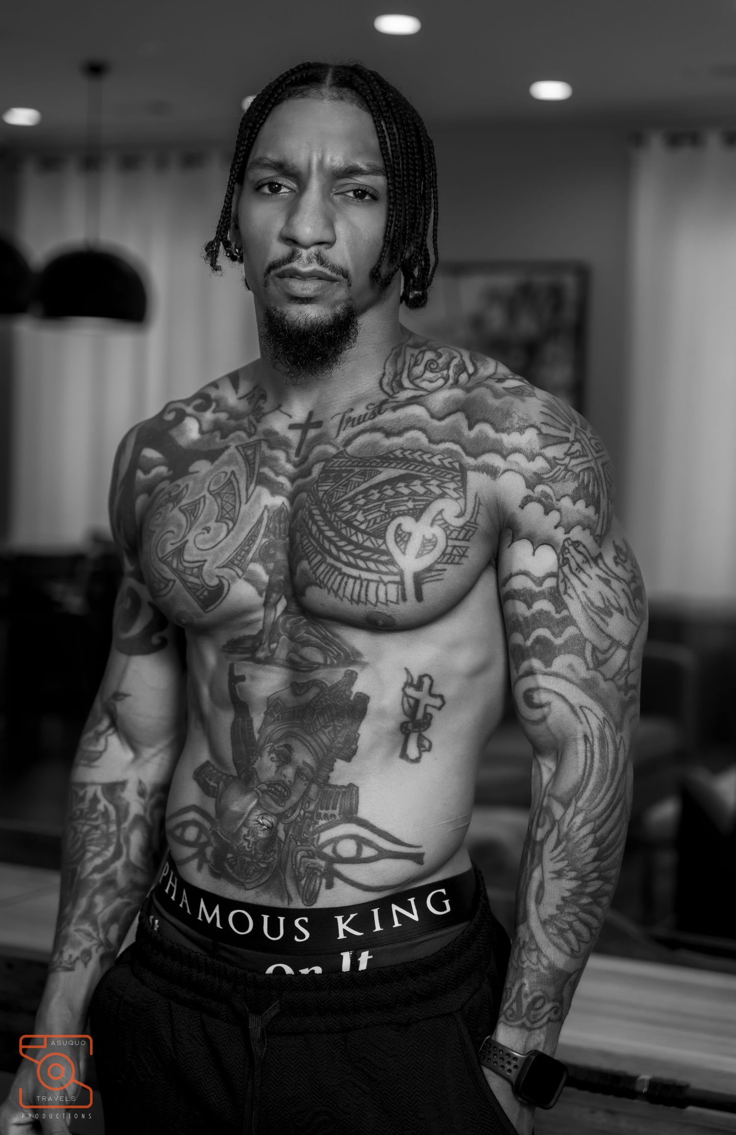 Black and white portrait series highlighting intricate tattoo artwork and athletic build.