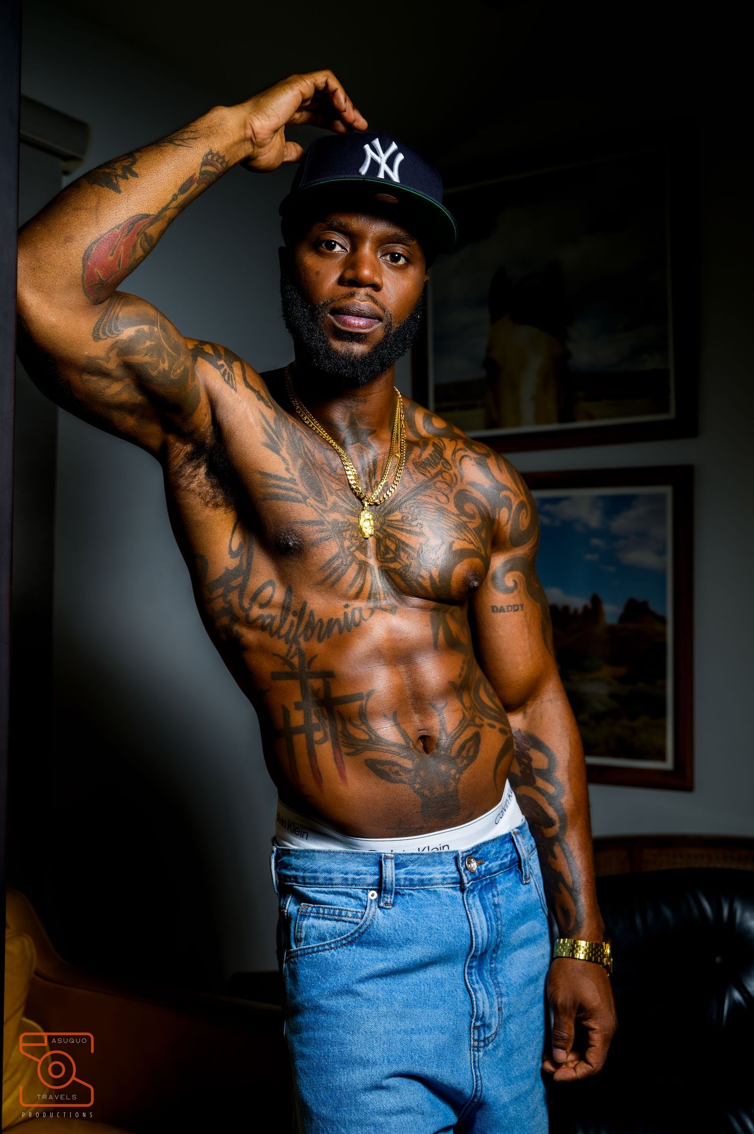 Series of artistic portraits showing muscular physique with tattoos and denim jeans.