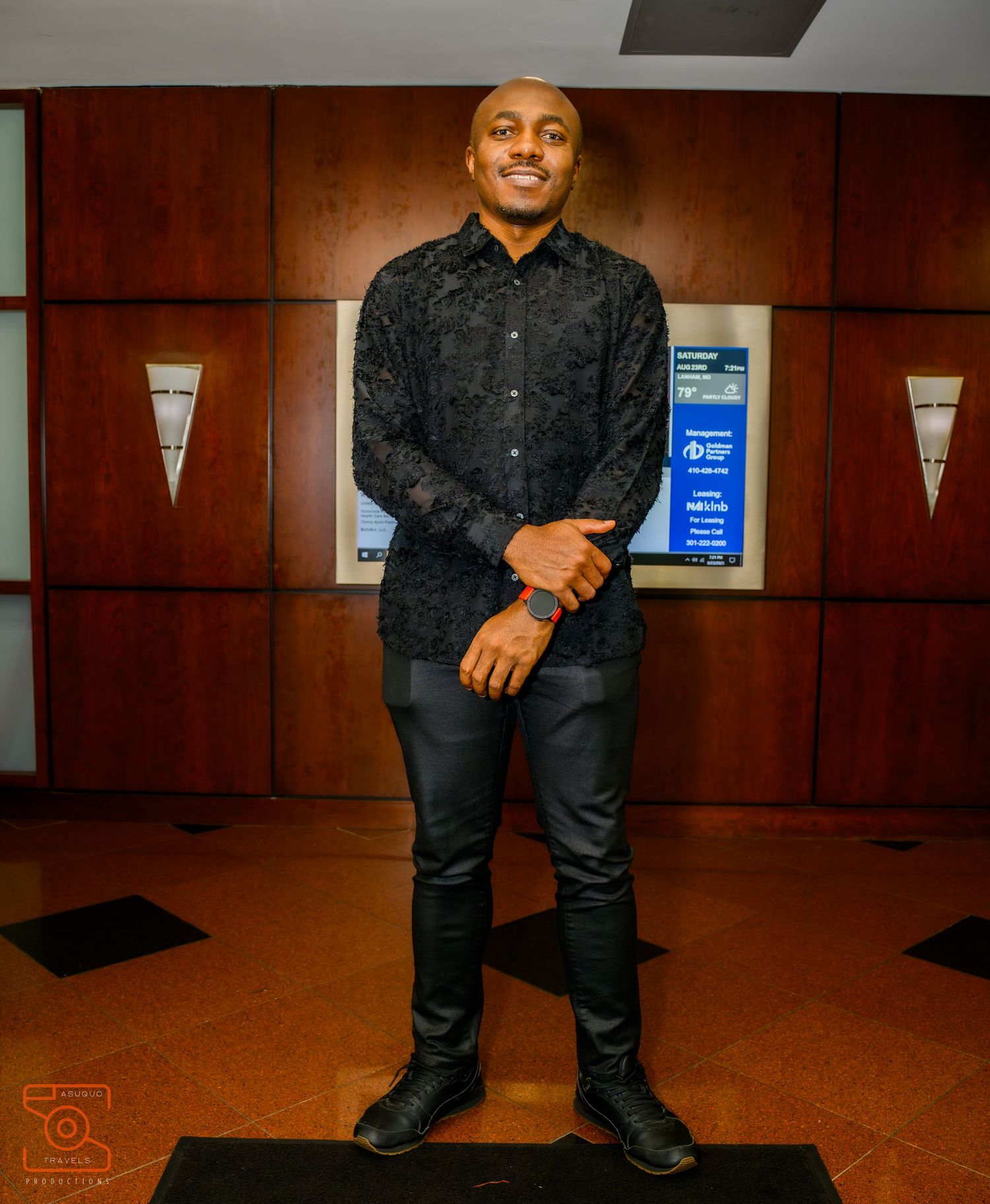 Series of casual poses in an office hallway with wood paneling.