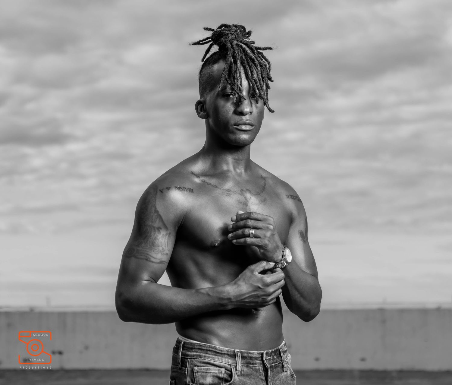 Four dramatic black and white artistic photographs showing a shirtless athlete in various poses against a cloudy sky.