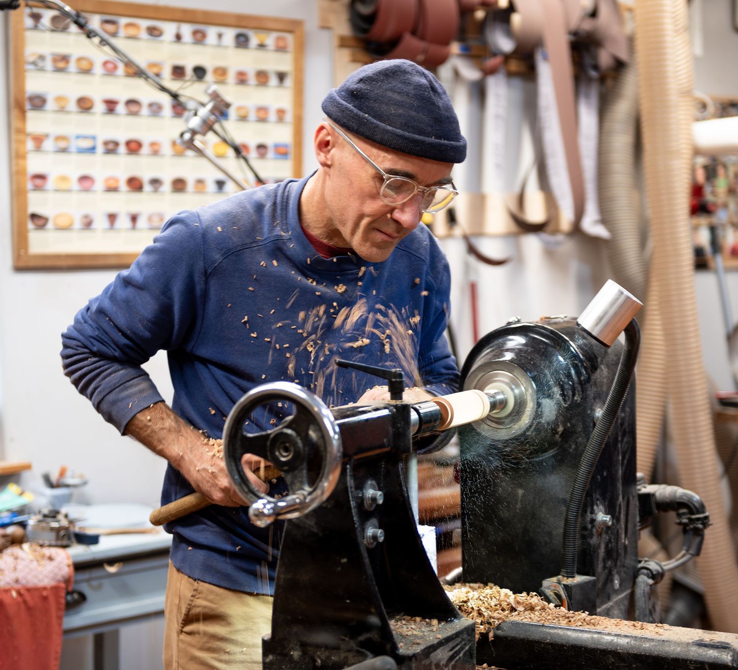 world renowned wood turner turning wood in a wood shop with wood working tools and lathe located in Turner, OR