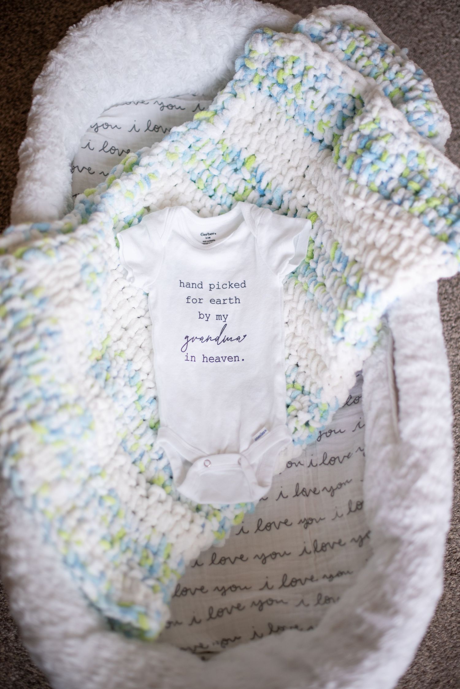 Baby clothing in a baby bassinet