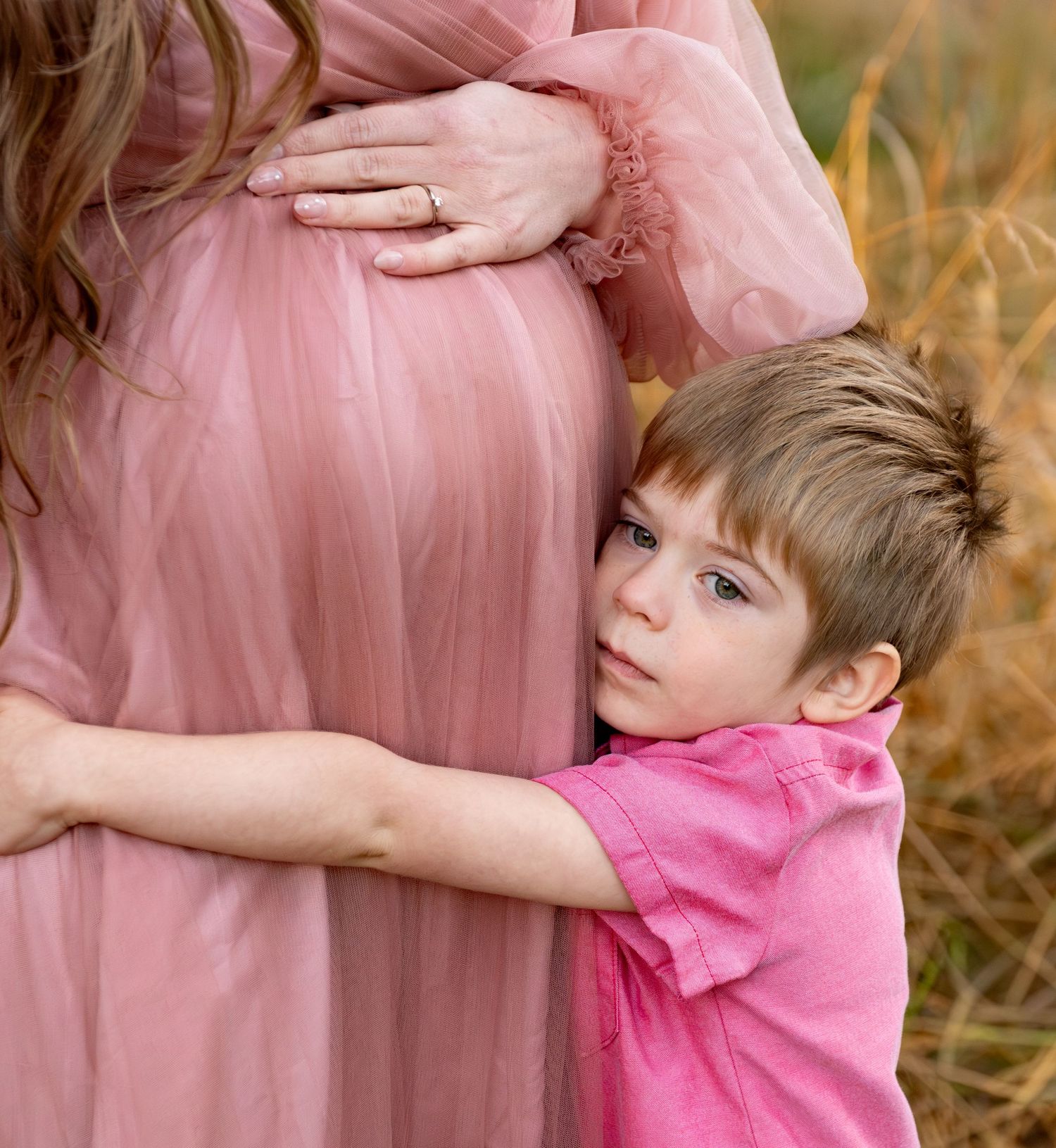Mother and son posing together in a field in Salem OR