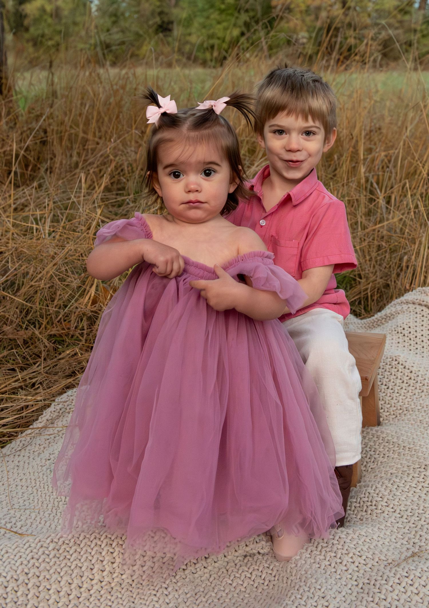 young Brother and sister posed together in a field located in Salem, OR