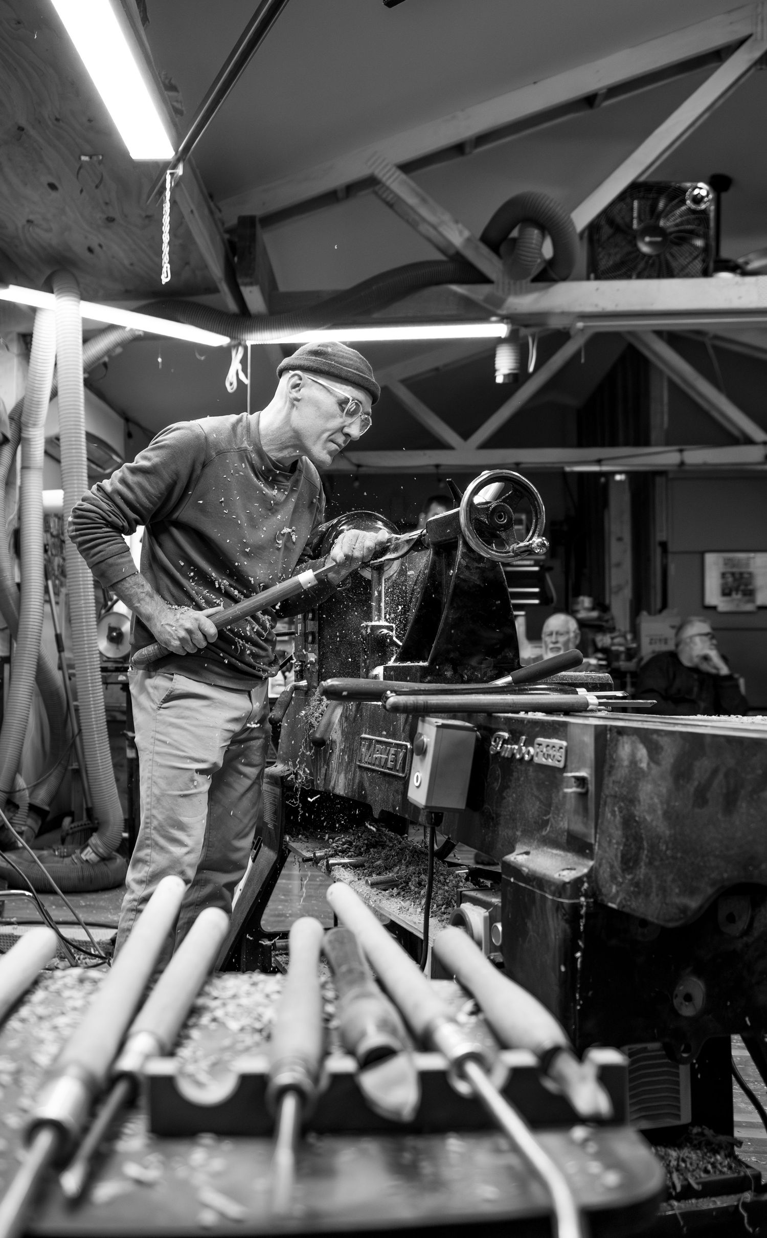world renowned wood turner turning wood in a wood shop with wood working tools and lathe located in Turner, OR