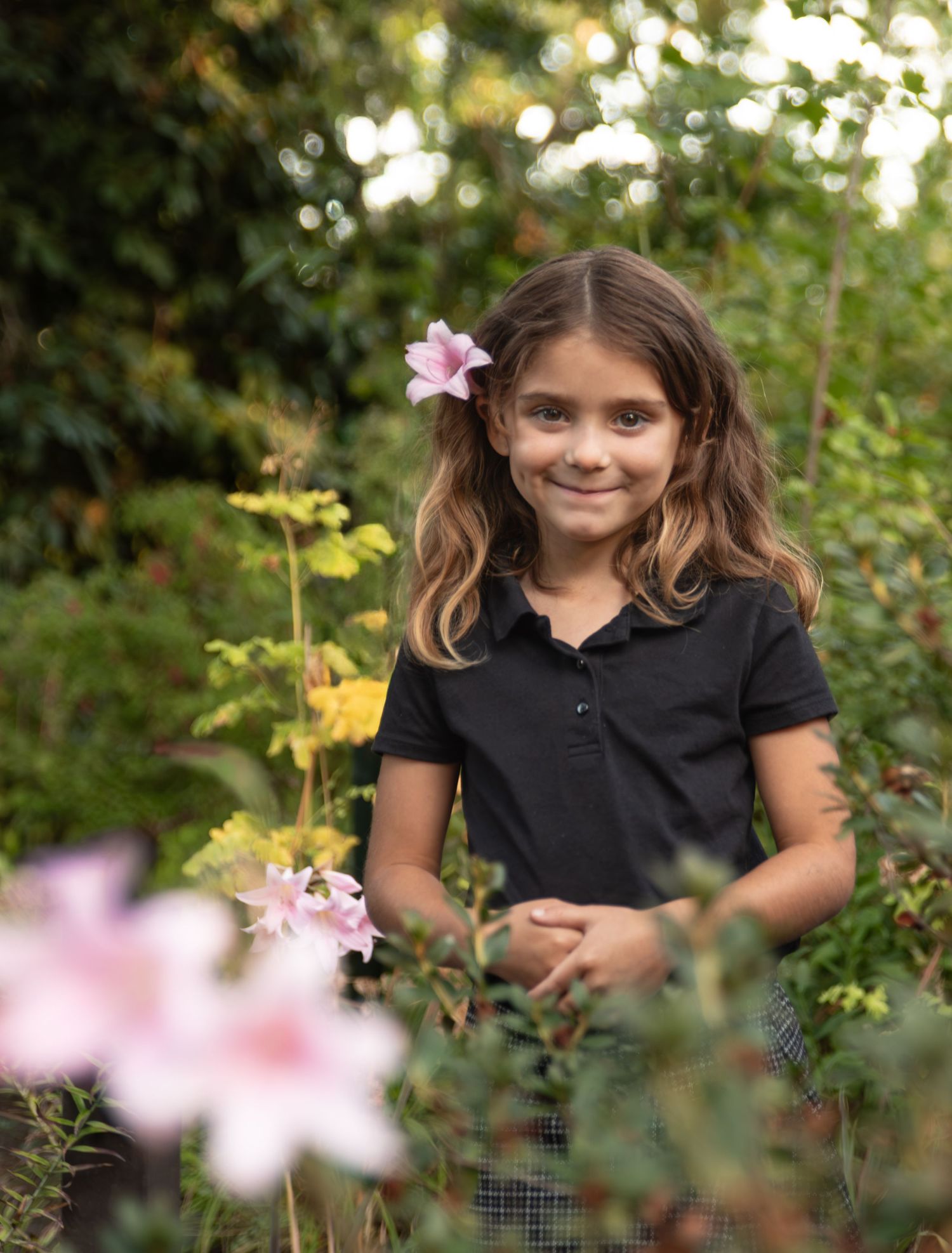 Child Headshot image among late fall flowers in bush pasture park Salem, OR.