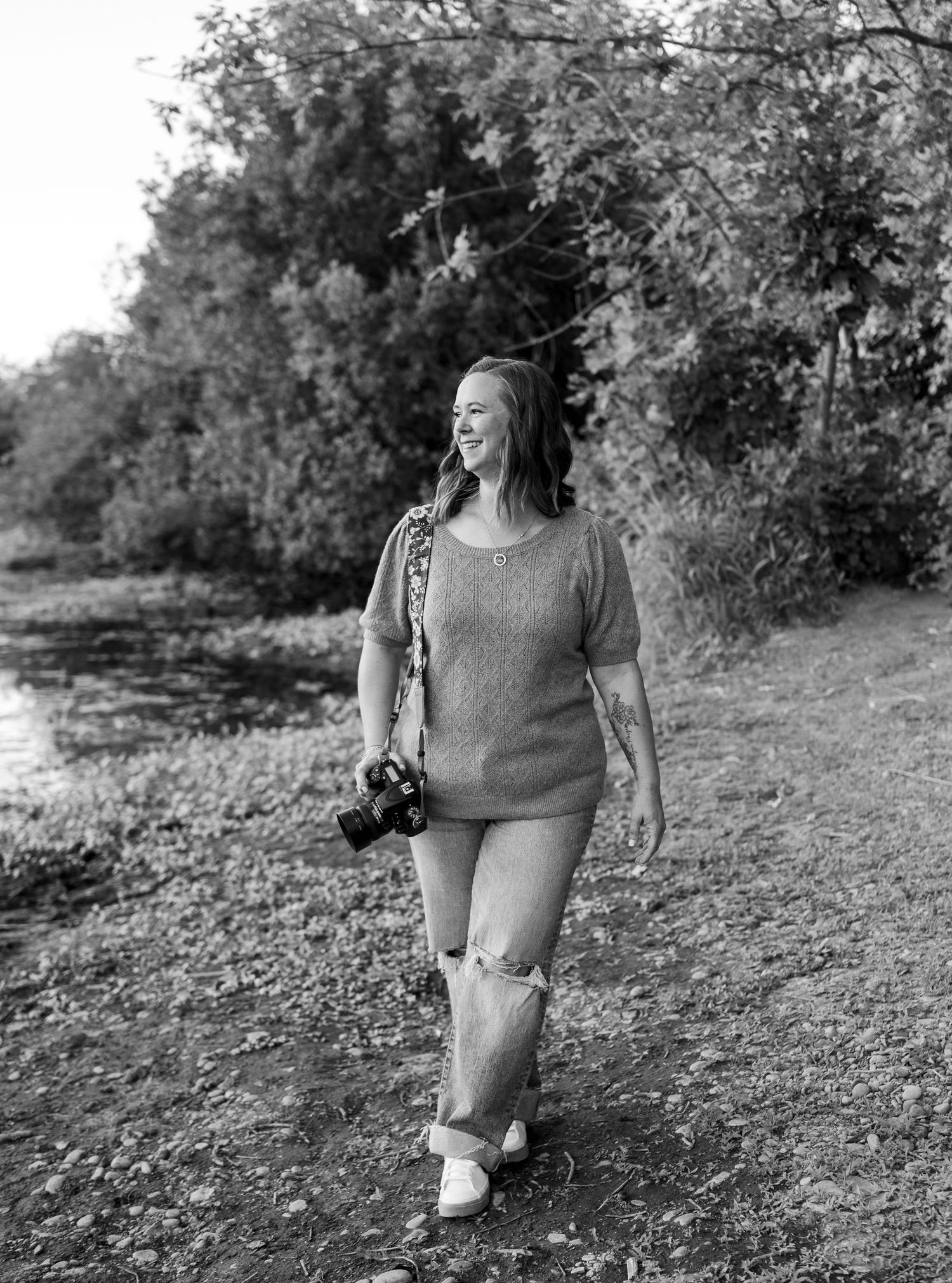 Black and white photo series showing someone in casual attire walking along a rocky hillside path on a sunny day.