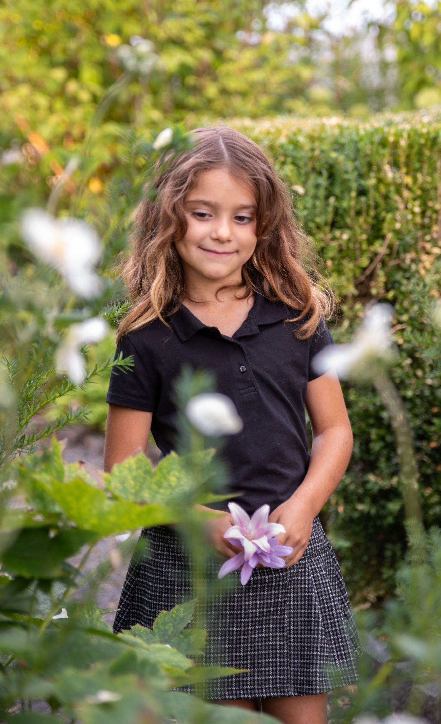 Child Headshot image among late fall flowers in bush pasture park Salem, OR.