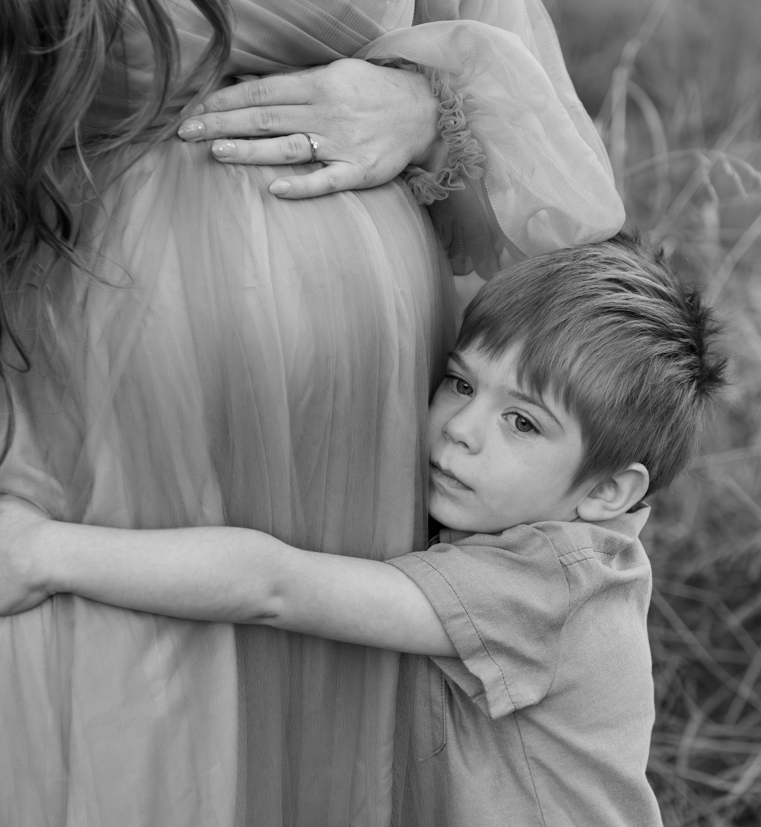 Mother and son posing together in a field in Salem OR